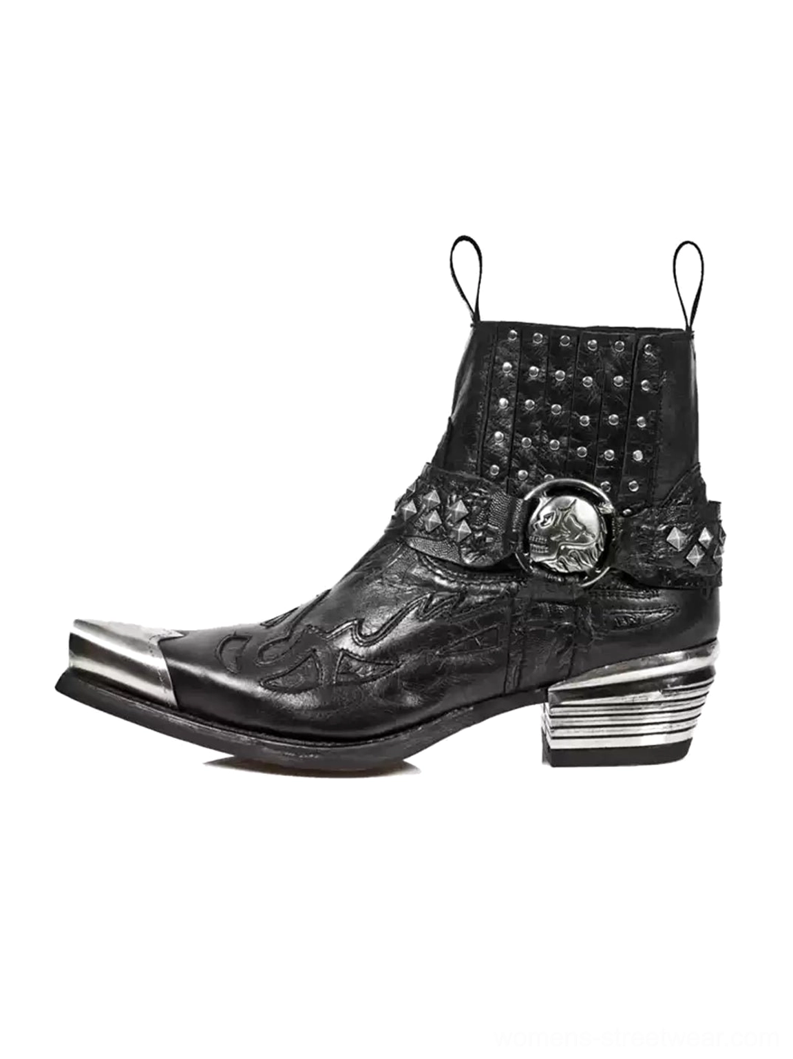Single black studded pointed-toe western Chelsea boot with silver metal toe cap skull buckle strap embossed leather upper and layered block heel