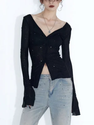 Black studded sheer ribbed button cardigan top front view styled with light blue jeans and layered necklaces