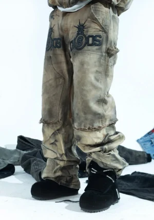 Black suede-textured platform winter boots styled with distressed washed camo cargo pants in a contemporary Korean streetwear outfit