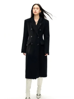 Black tailored double-breasted wool long coat with notched lapel and longline silhouette