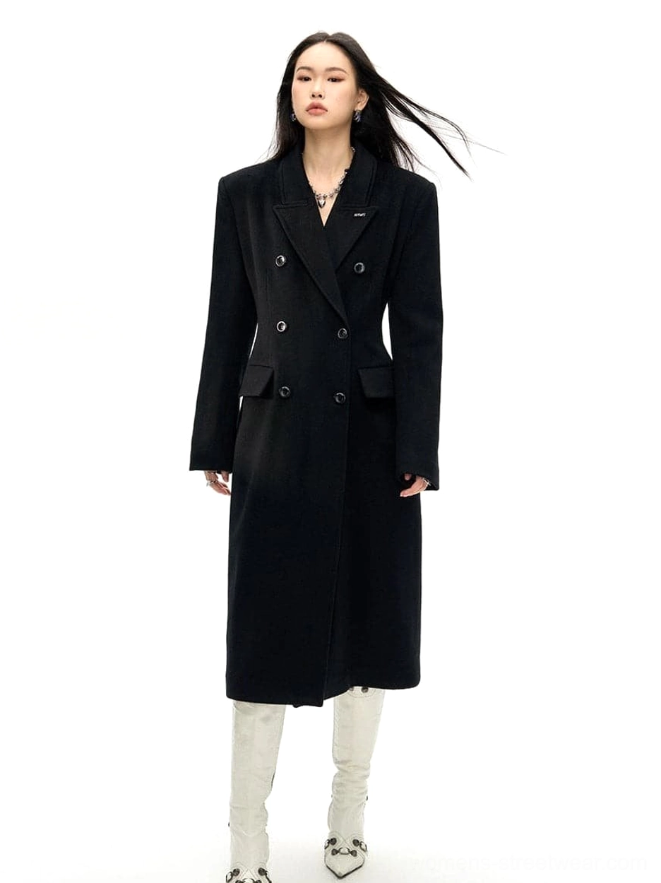 Black tailored double-breasted wool long coat with notched lapel and longline silhouette