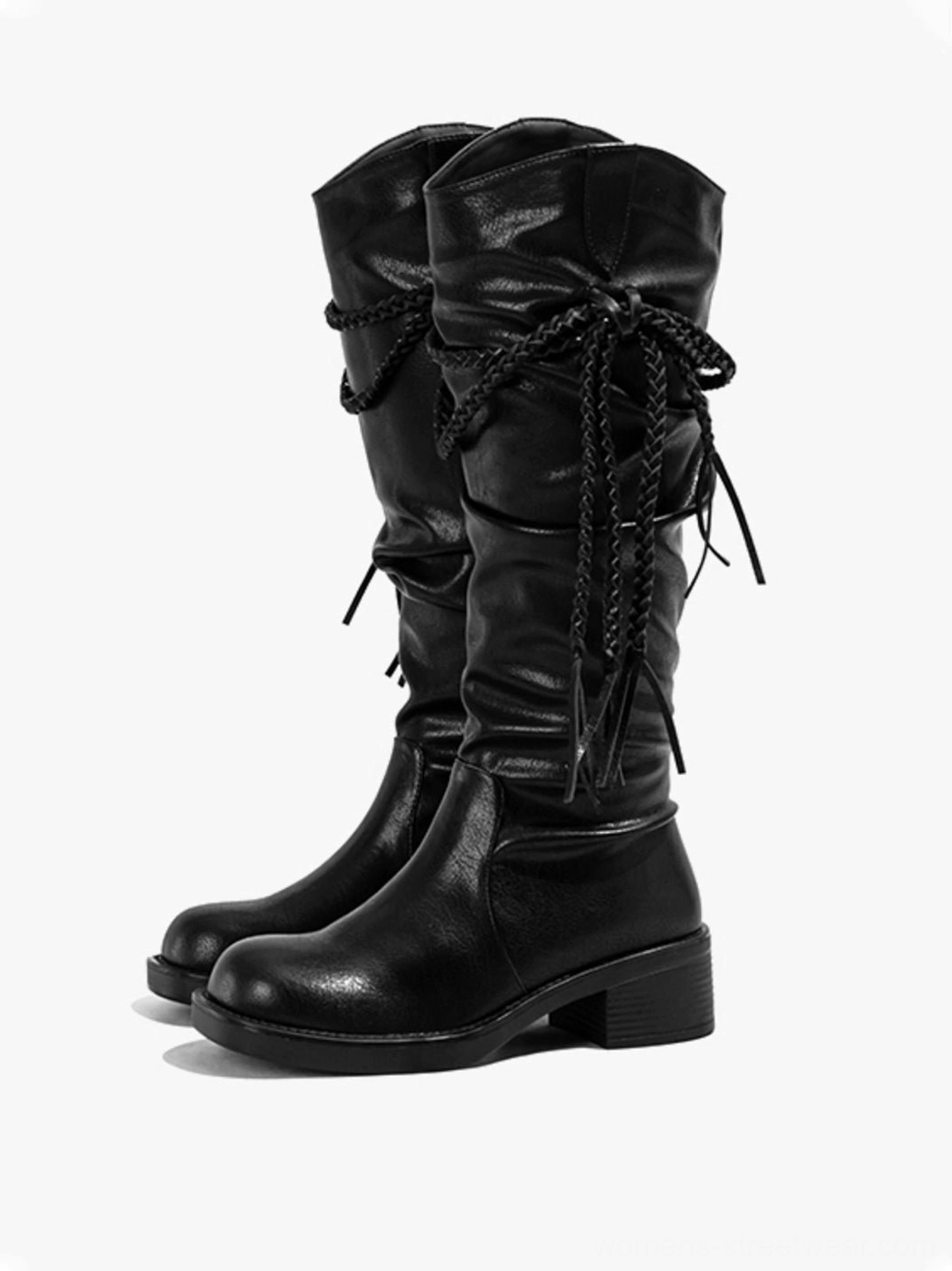 Pair of black tassel lace over-the-knee riding boots with slouchy shafts rounded square toes and chunky low heels
