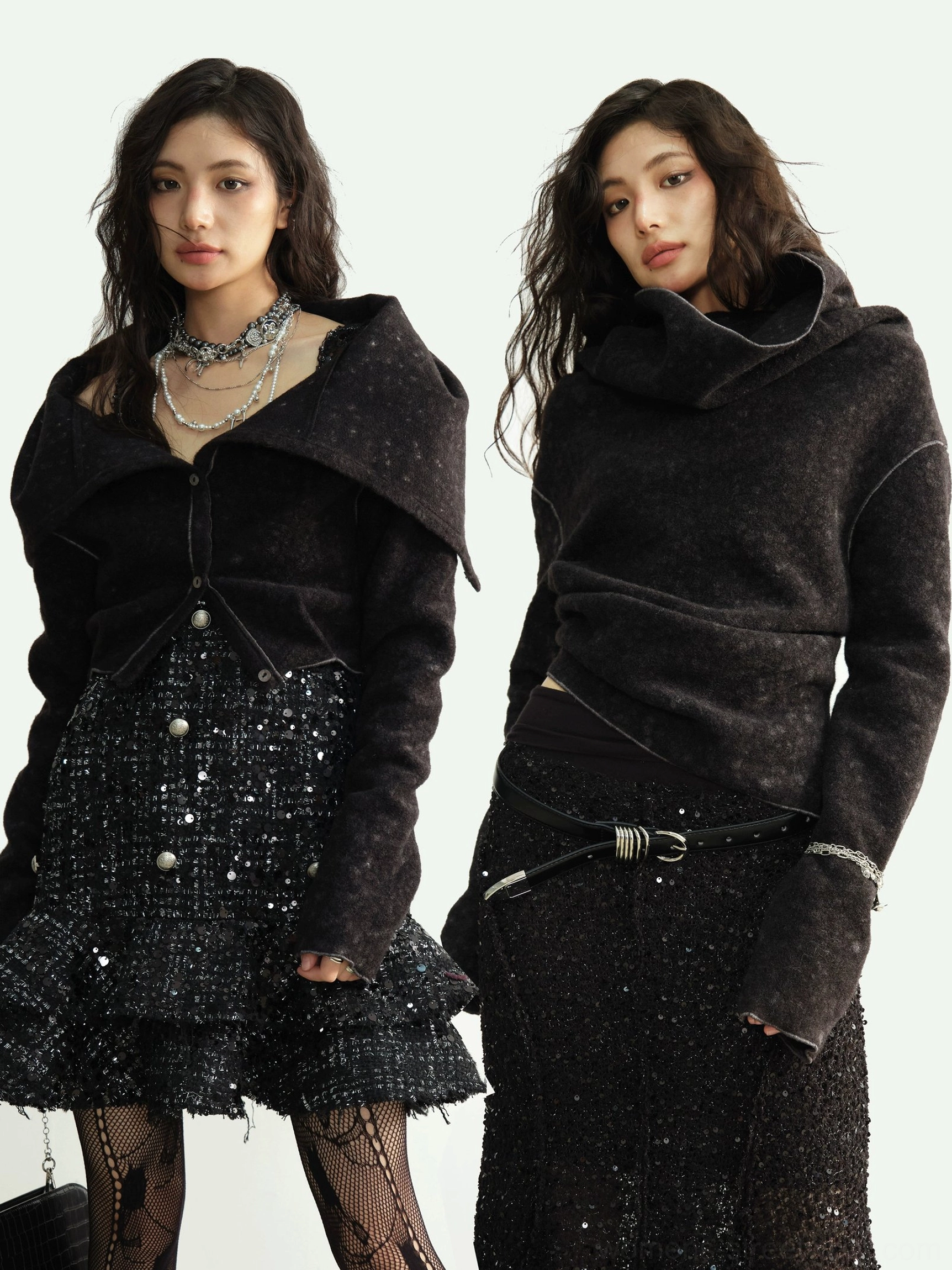 Black textured cowl-neck cropped knit cardigan styled with a sparkly tweed skirt and layered silver necklaces in a front three-quarter studio view