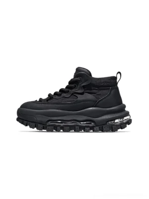 Black trail platform sneakers left side profile with textured matte upper, air cushion midsole and chunky lug sole