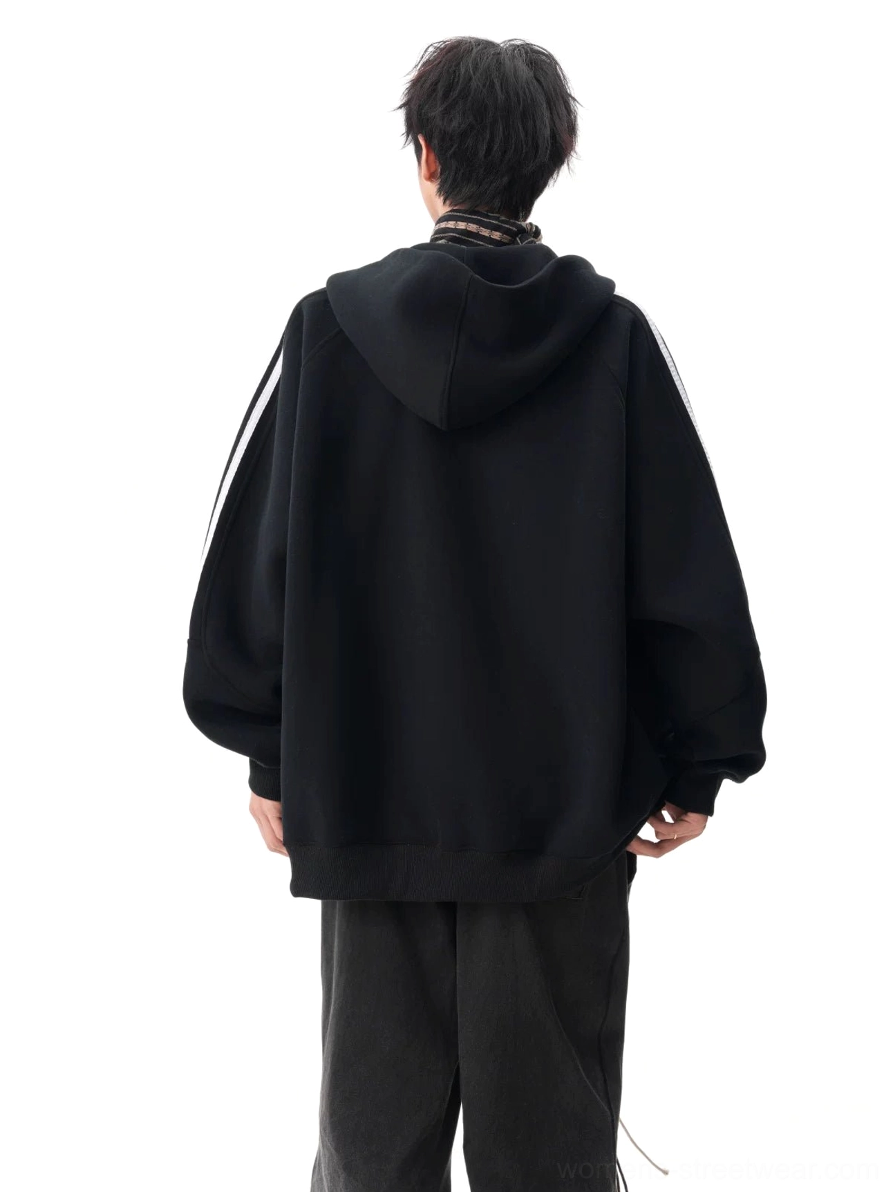 Back view of a black triple stripe hooded sweatshirt jacket with shoulder stripes extending down the sleeves and relaxed streetwear silhouette