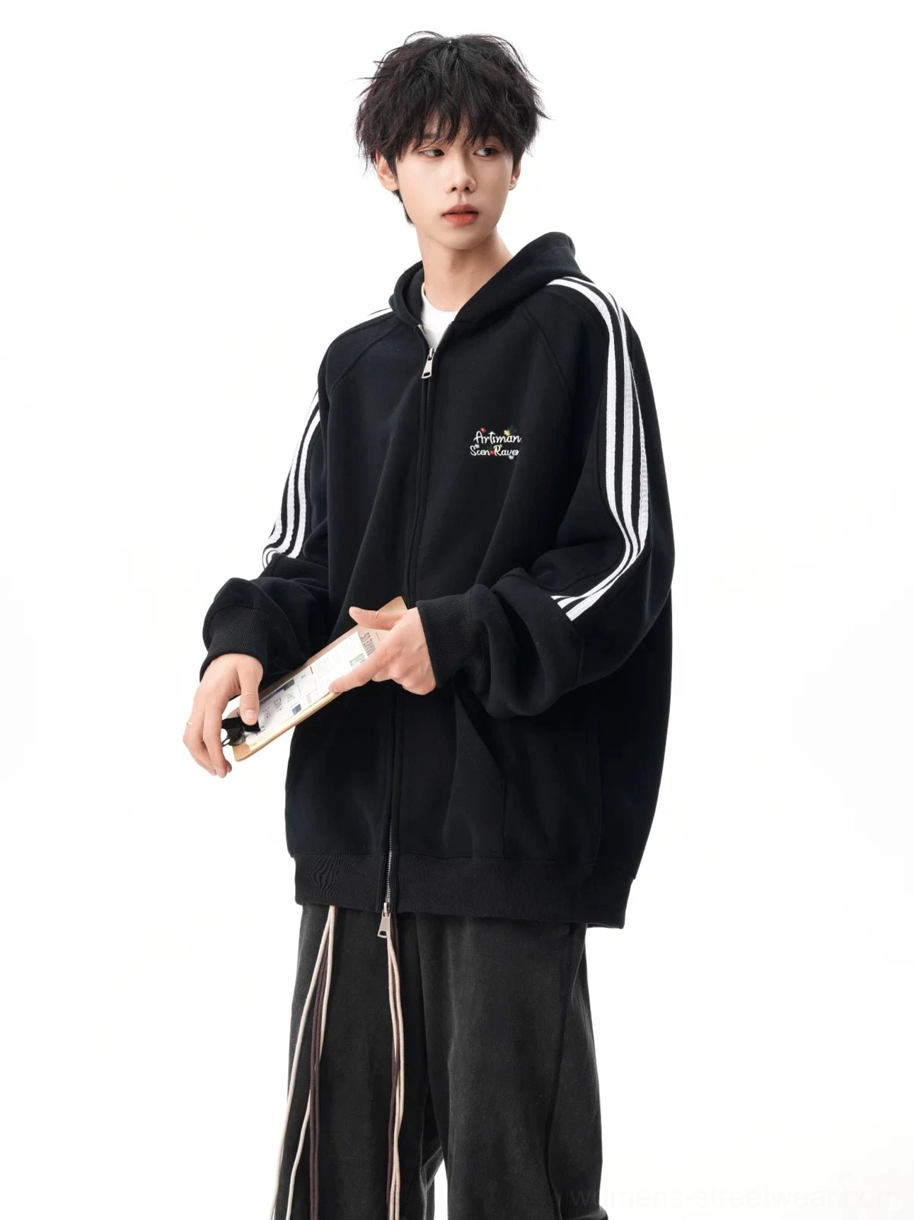 Side view of black full-zip streetwear hoodie with triple sleeve stripes, front kangaroo pocket, and drop shoulder fit