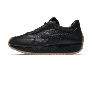 Black tumbled leather sculpted platform sneakers with low-top lace-up design and contrasting brown gum rubber outsole