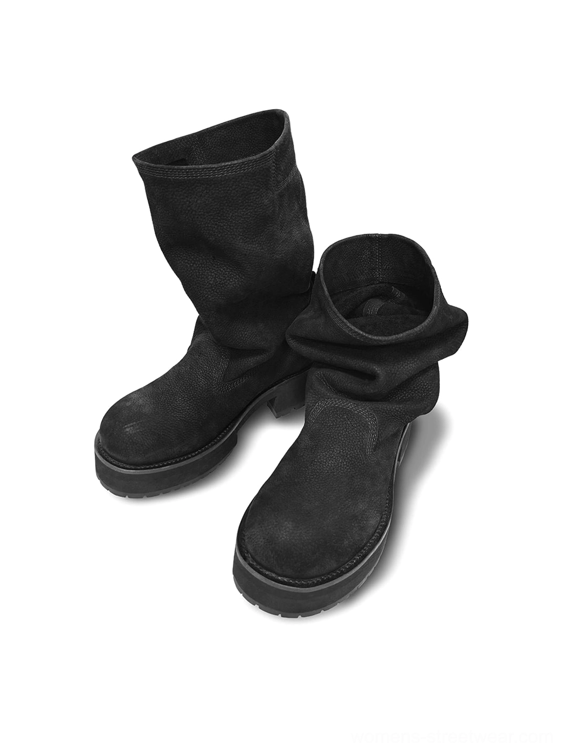 Oblique top-down display of a pair of black tumbled leather slouch mid-calf boots with folded shafts and thick molded outsoles
