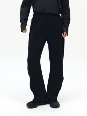 Black twill drawstring sweatpants front view - relaxed fit streetwear essentials with twisted bone seam design
