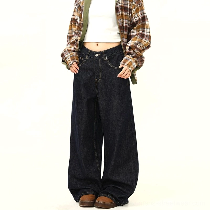 Cropped front three quarter view of black ultra wide leg jeans showing front pockets clean denim finish and casual urban styling