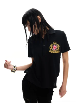 Black Union crest streetwear polo shirt front three quarter view with gold embroidered chest shield