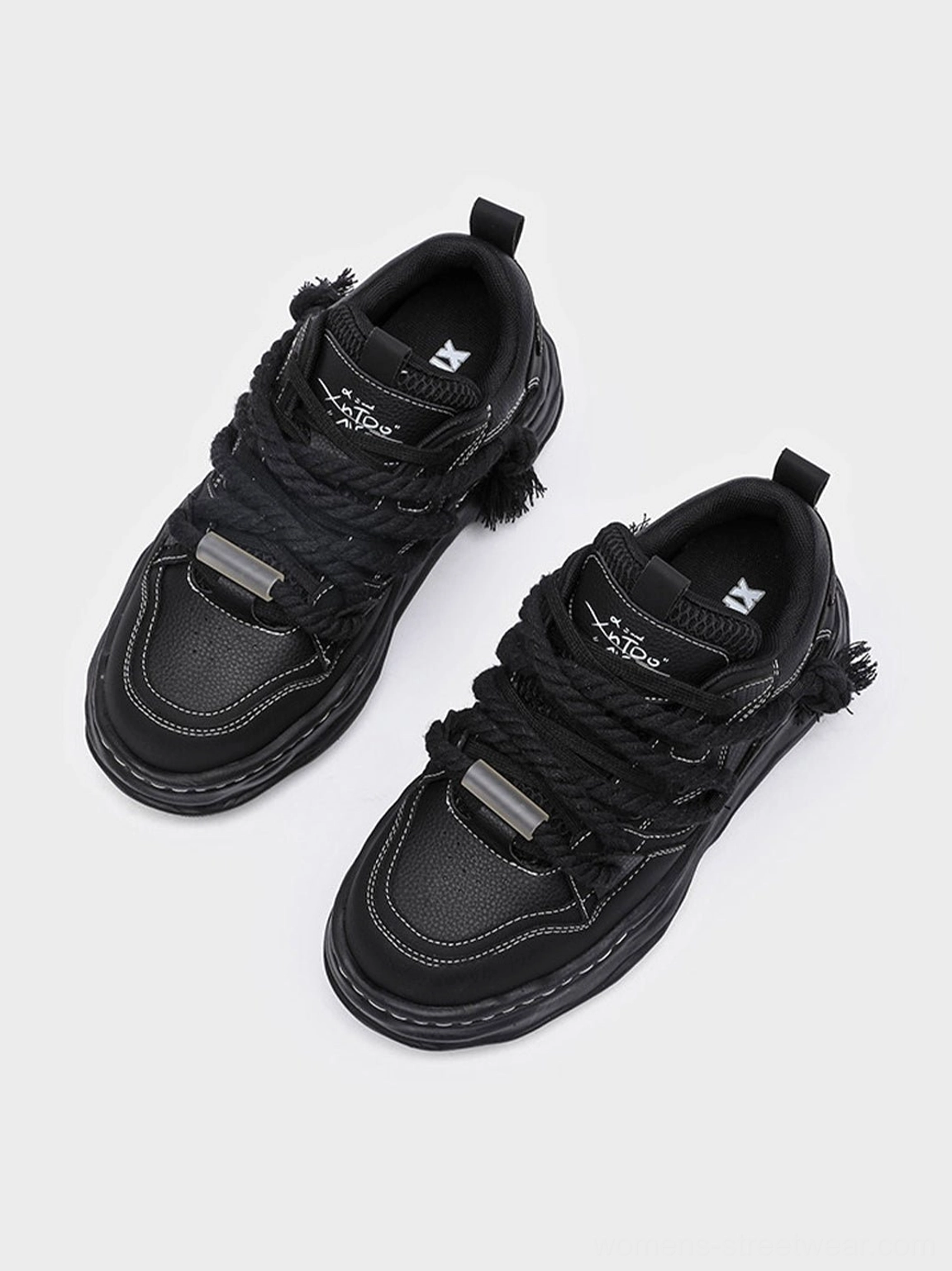 Black unisex wavy platform sneakers with rounded chunky silhouette and elevated fashion streetwear sole