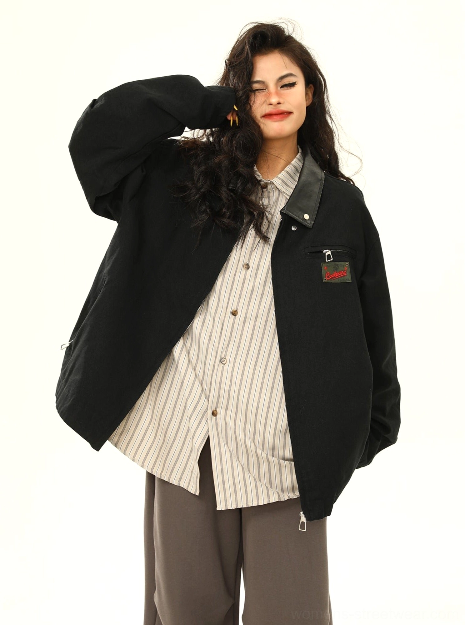 Three-quarter side view of a black vintage cargo jacket with front zipper closure, soft relaxed fabric appearance, and oversized urban streetwear fit