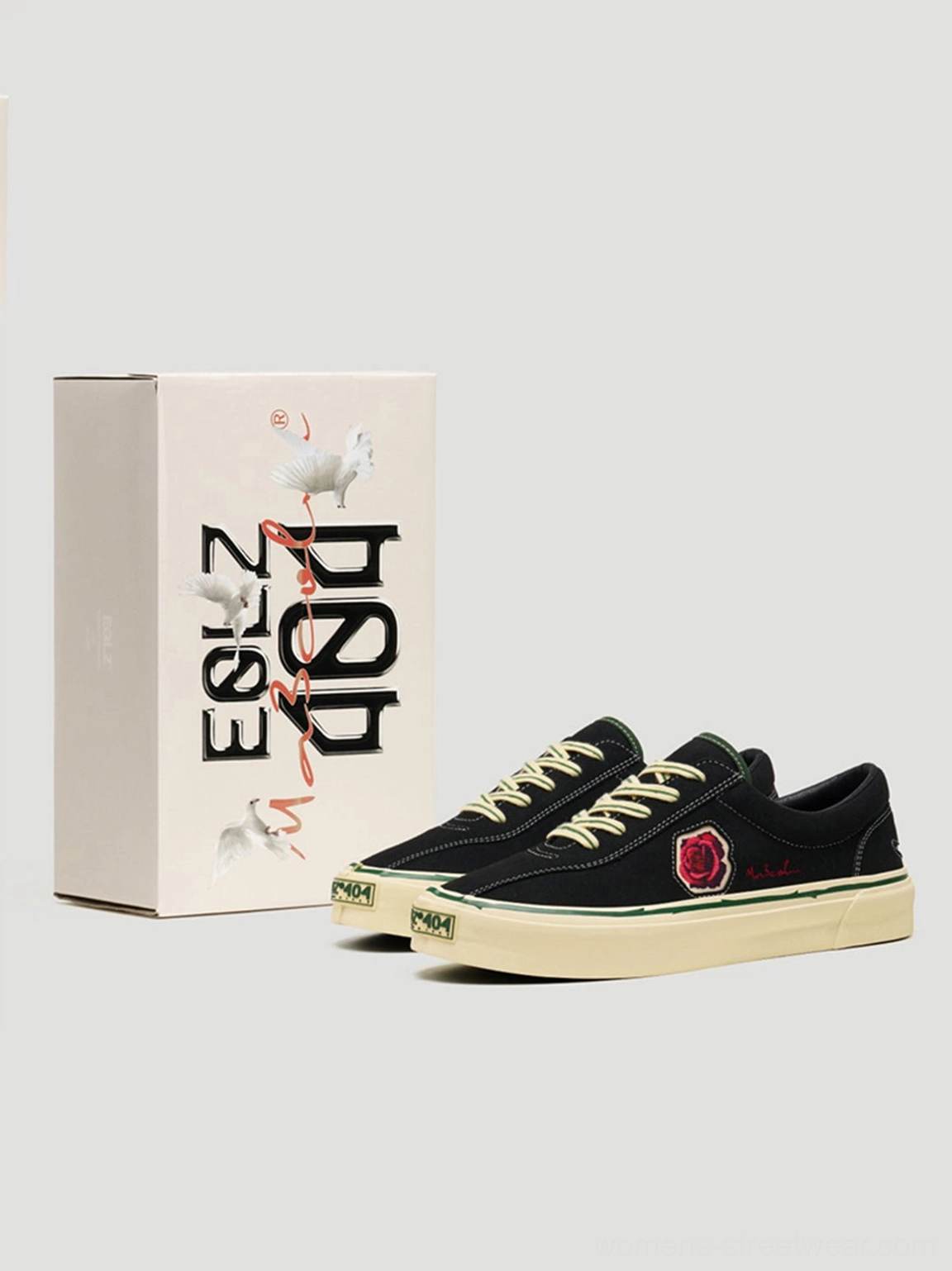 Black embroidered skate sneakers with vintage off-white sole and low-top profile for Y2K and alternative streetwear styling