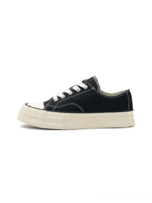 Black vulcanized canvas platform low-top sneakers with off-white rubber sole shown in left side product view