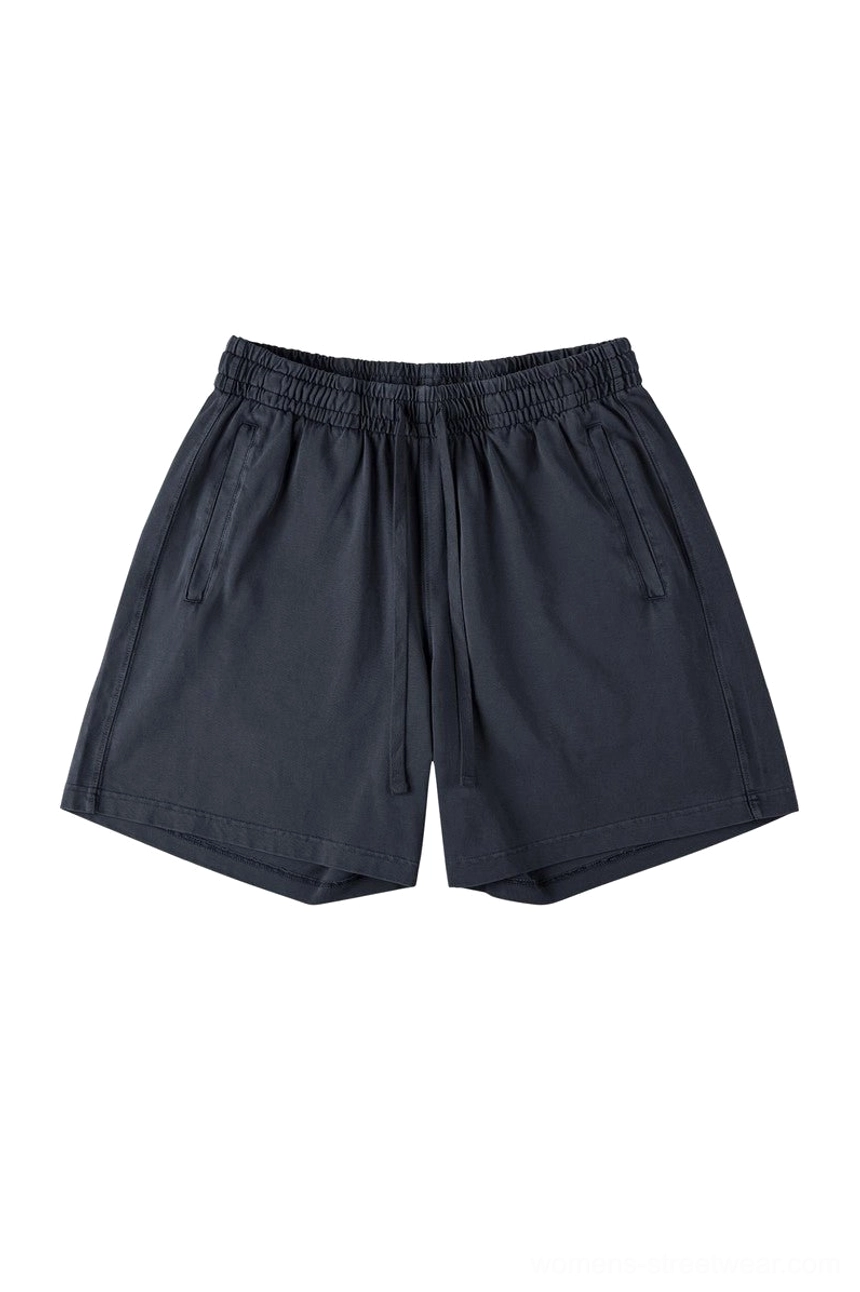 Black washed cotton oversized streetwear shorts featuring relaxed straight leg elastic drawstring waist and side slash pockets