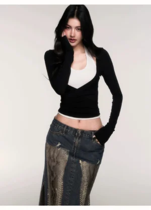 Three quarter view of black and white cropped wrap layer top with built in halter neckline and slim waist defining Korean streetwear fit