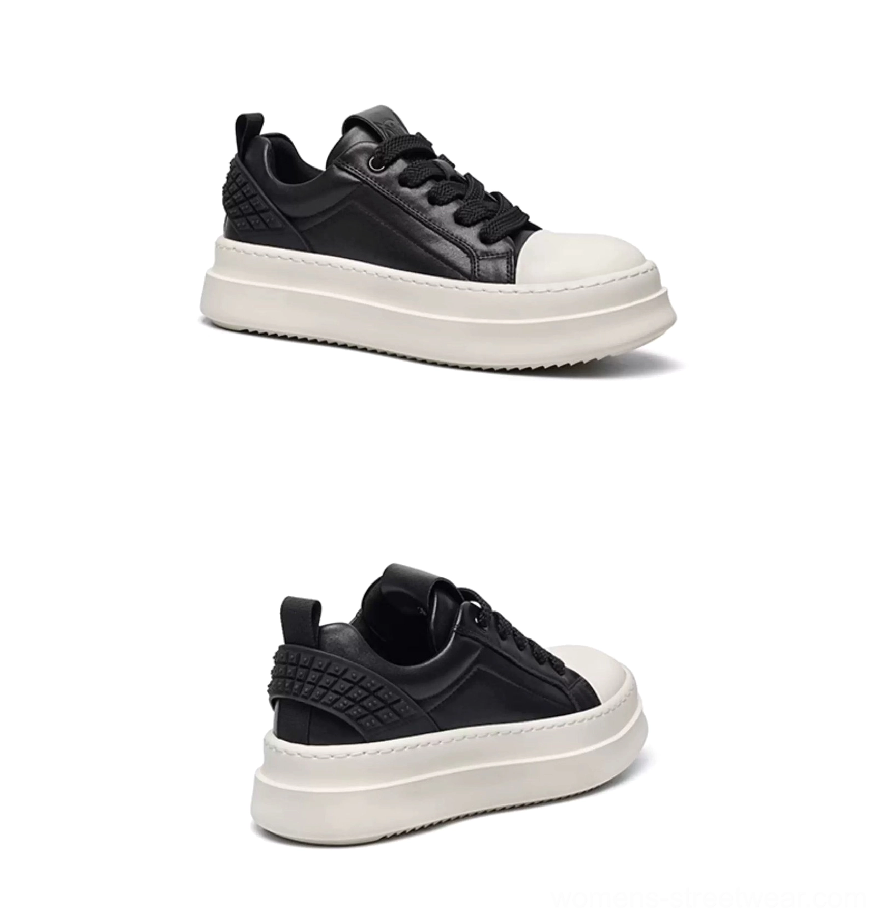 Black and white low-top leather platform sneakers with rounded toe cap and lace-up front three-quarter view