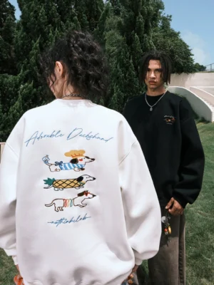 Black and white oversized dachshund graphic sweatshirts modeled from the rear with matching colorful back embroidery-style streetwear designs