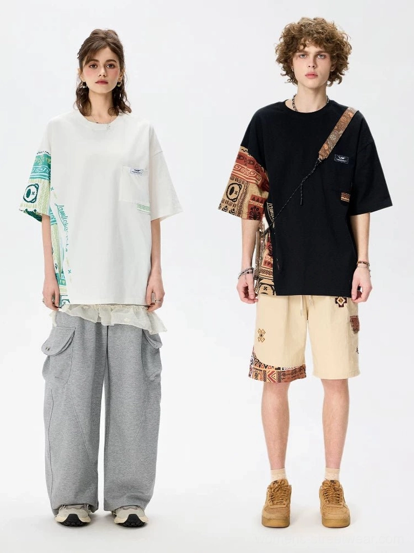 Black and white oversized tribal panel cotton T-shirts worn in relaxed unisex streetwear outfits with loose pants and shorts