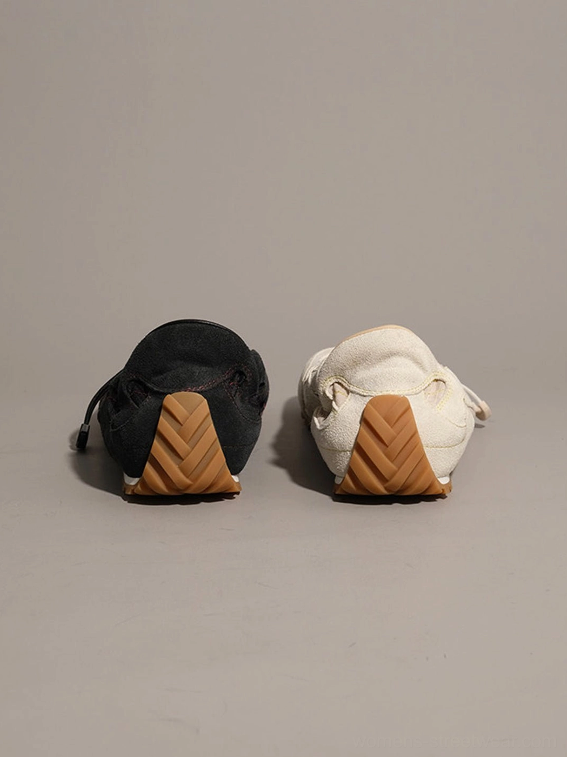 Black and white paneled nubuck streetwear trainers with flexible gum rubber outsole