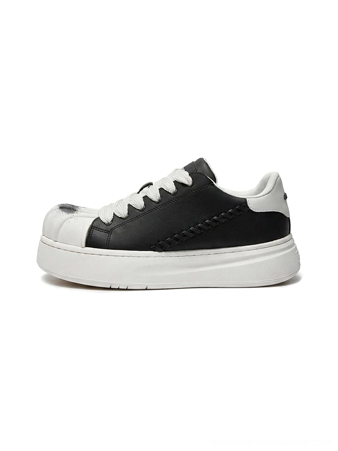 Black and white shell toe platform derby sneaker shown in left profile with black synthetic leather upper, white sculpted toe cap, chunky platform sole, and woven heel stitching