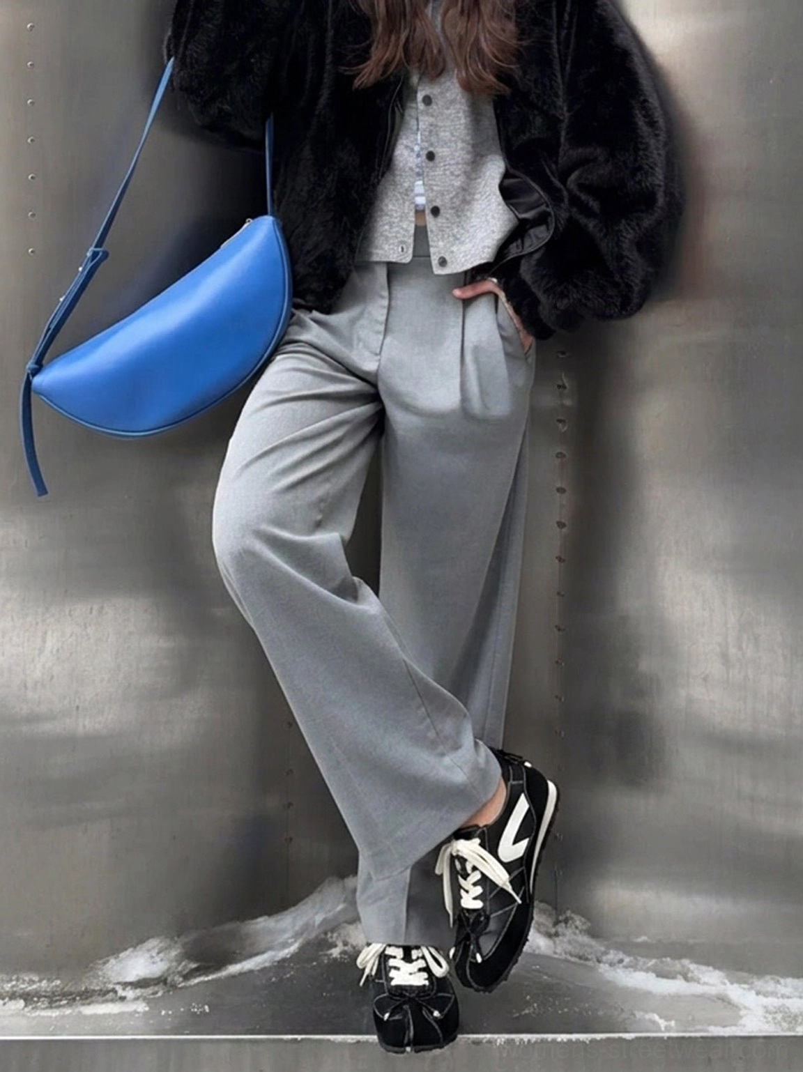 Black and white square-toe lace-up ballet flats styled with wide-leg gray trousers and a textured streetwear coat