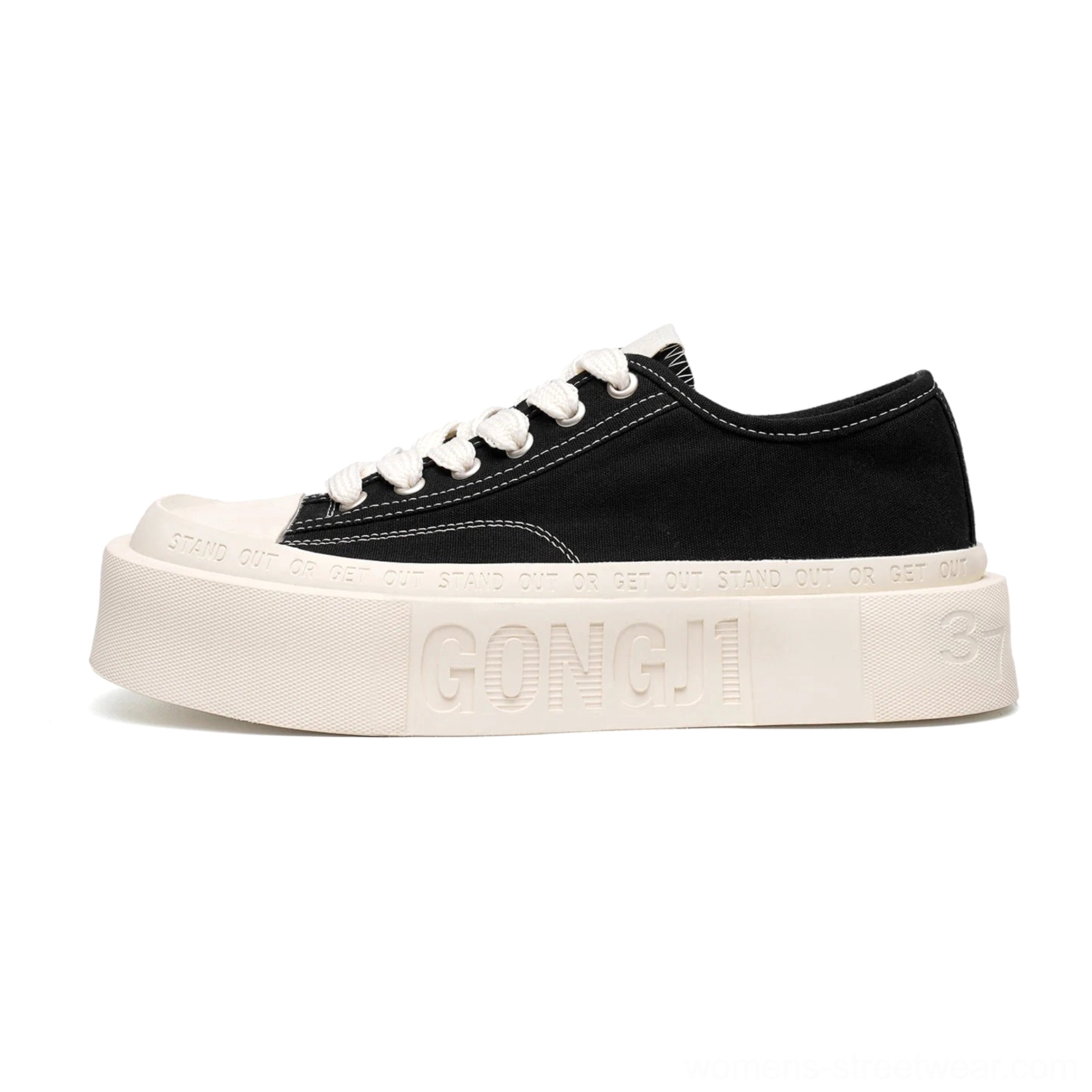 Side view of black and white square toe platform canvas sneakers with a sculpted thick sole for streetwear styling