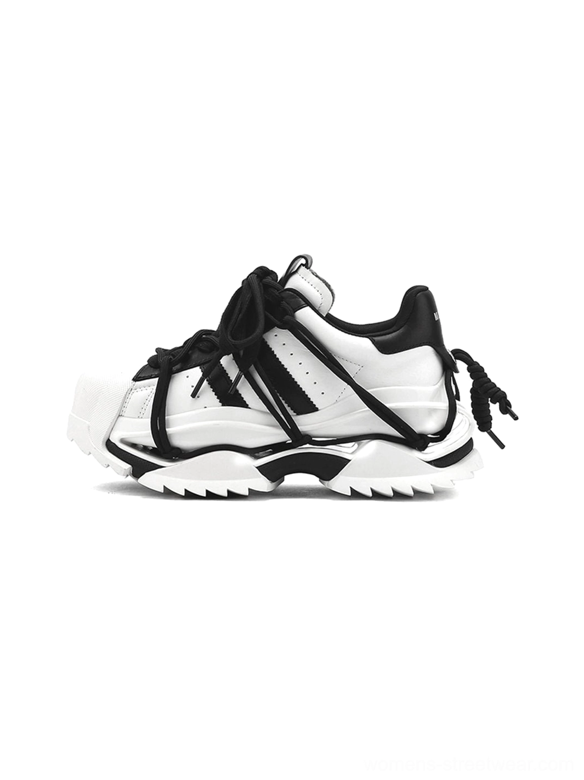 Black and white strapped chunky sneakers with sculpted sole, layered lace-up straps, shell-inspired toe cap, and rugged streetwear outsole shown in a studio side view