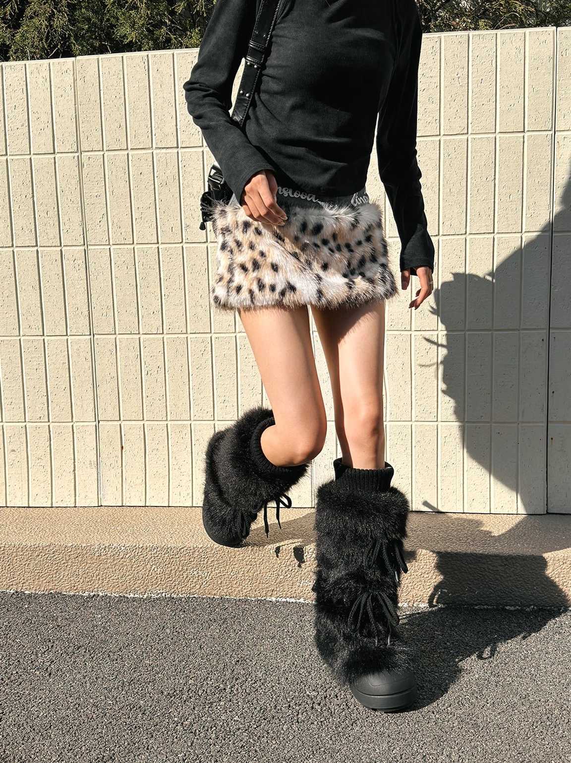 Black and white tall platform boots designed for skirts, cargos, and layered winter outfits