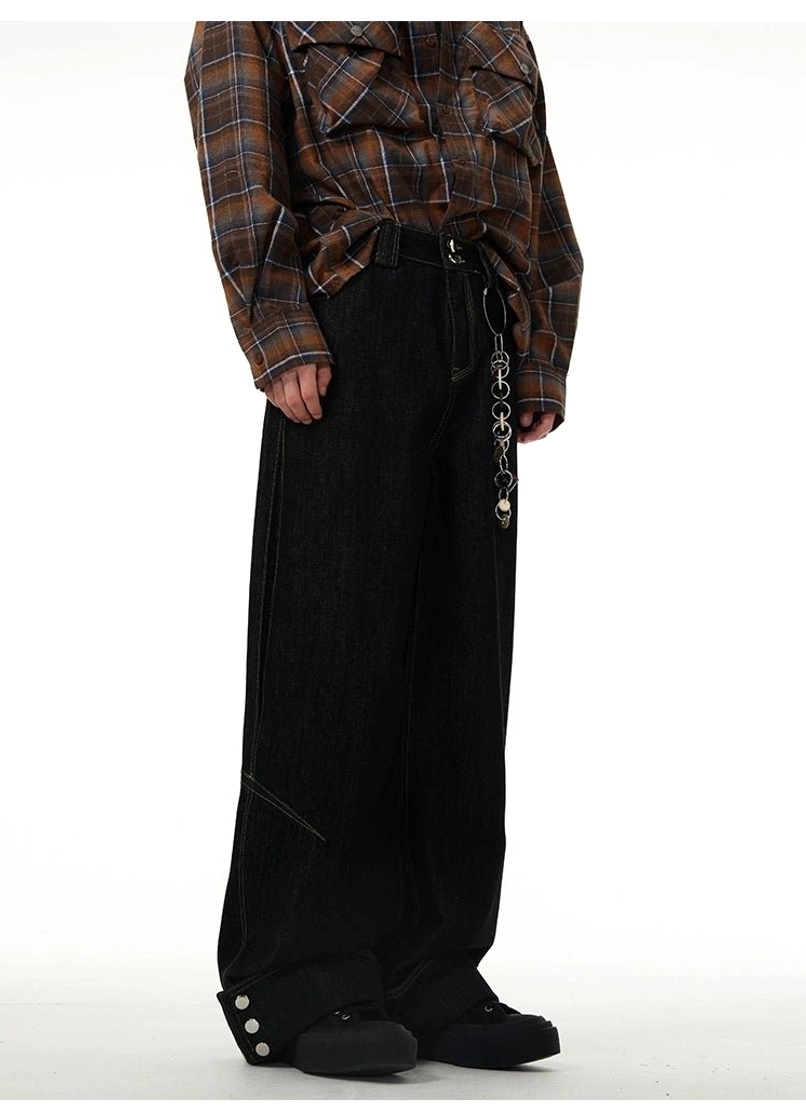 Black wide-leg cuffed jeans with button details and relaxed streetwear silhouette for modern Korean fashion outfits