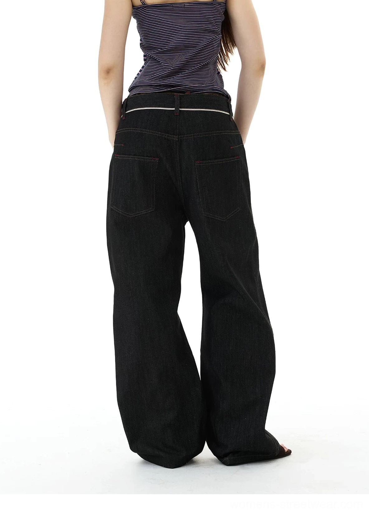 Back view of black wide-leg denim jeans showing dual rear pockets, contrast waistband trim, and full-length loose legs