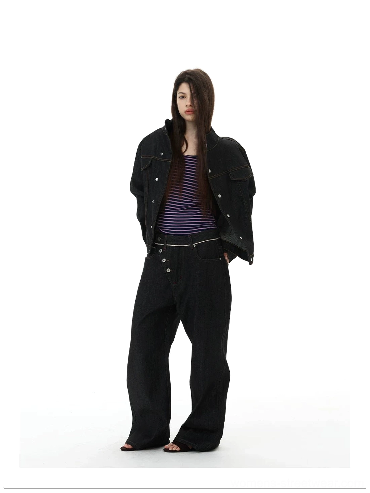 Black wide-leg denim jeans styled with a matching denim jacket for a coordinated avant-garde streetwear outfit