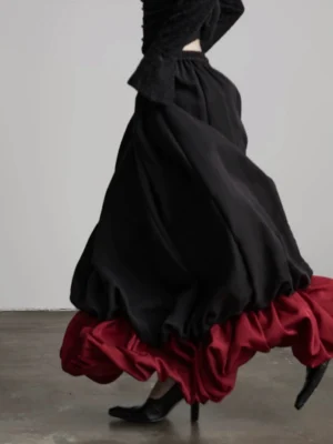 Black and wine red gothic patchwork faux two-piece A-line maxi skirt with flowing hem detail