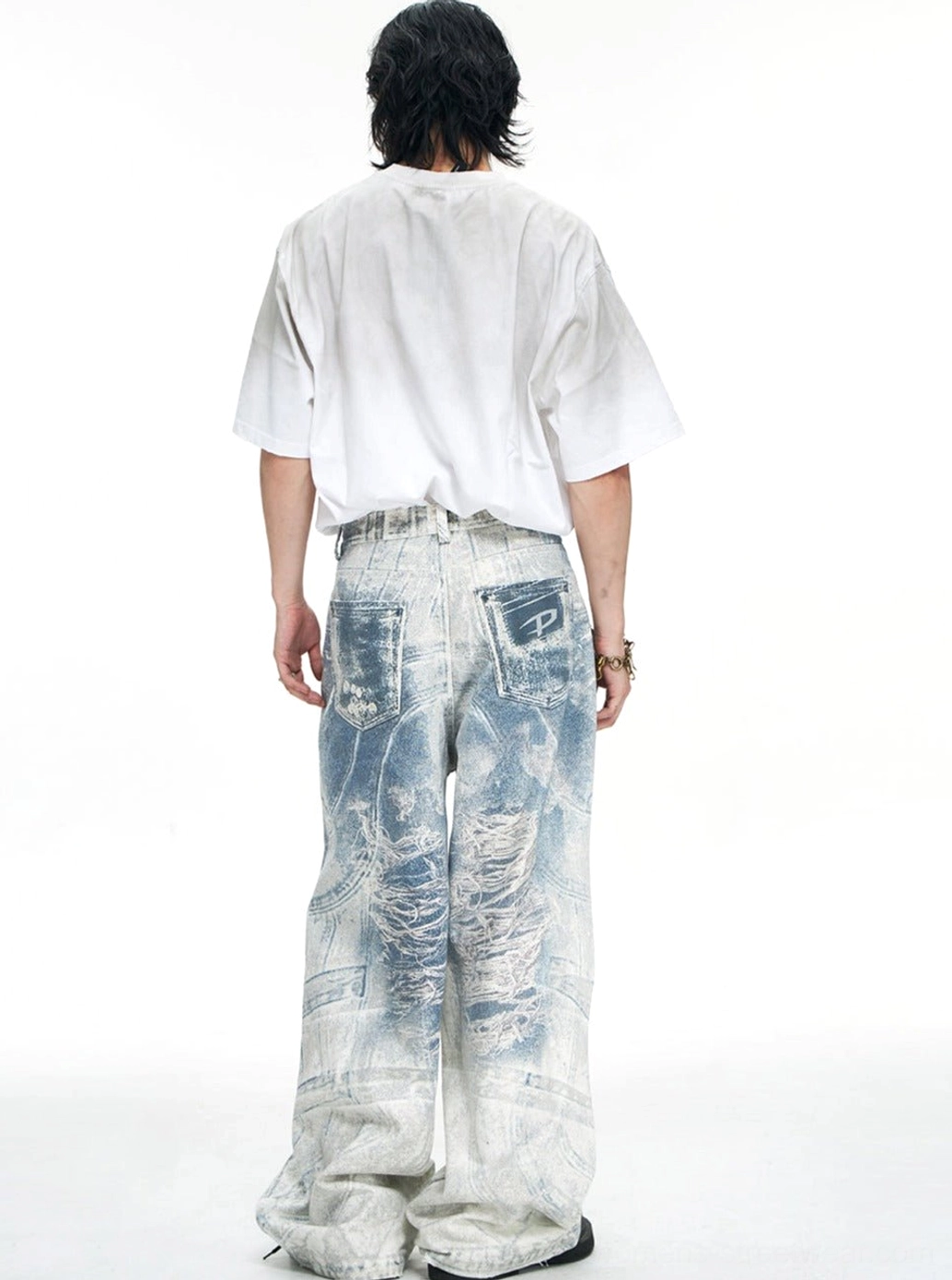 Blue acid-wash wide-leg baggy jeans product image showcasing the distressed denim finish, oversized silhouette, and Y2K streetwear style