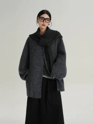 Blue And White charcoal blue grey oversized wool coat with layered knit scarf worn with black long skirt