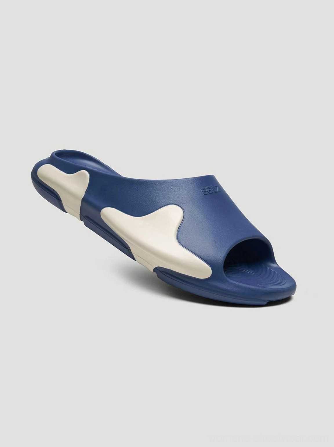Blue asymmetric colorblock cloud cushion slide sandals with open toe design and sculpted wave sole