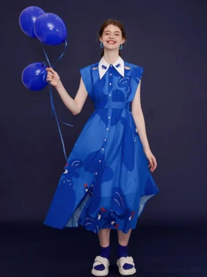 Full front view of a royal blue bird printed sleeveless midi shirt dress with white embroidered collar, flowing A-line skirt, and playful Korean-inspired streetwear styling