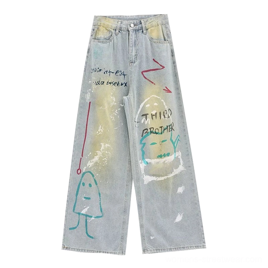 Flat lay view of blue clean graffiti wide-leg jeans with high-rise waist, painted graphic panels, faded denim wash, and relaxed full-length streetwear shape