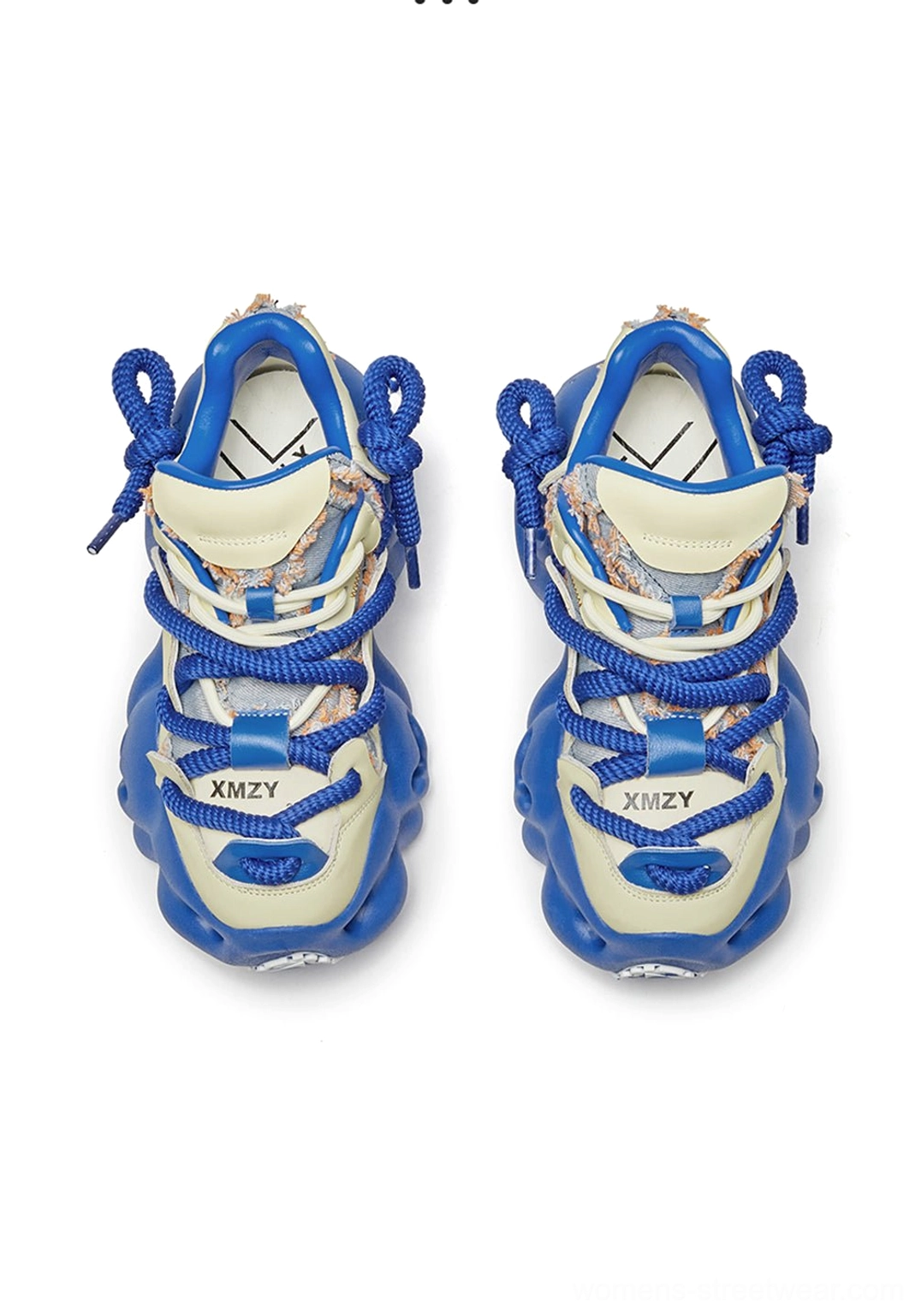 Top-down view of blue and cream chunky dad sneakers showing detailed lace system, printed upper, and layered streetwear design