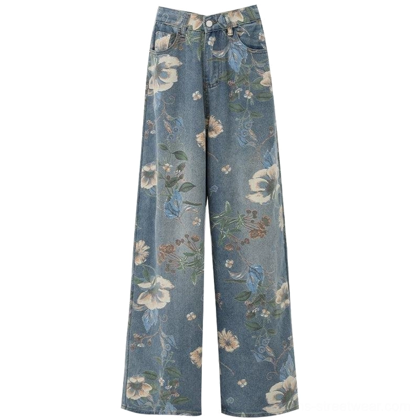 Blue floral distressed wide-leg jeans with high waist and relaxed contemporary denim silhouette