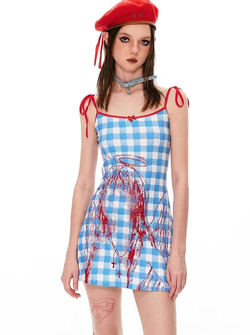 Blue gingham Y2K mini dress with red angel print, tie straps, and red beret streetwear styling