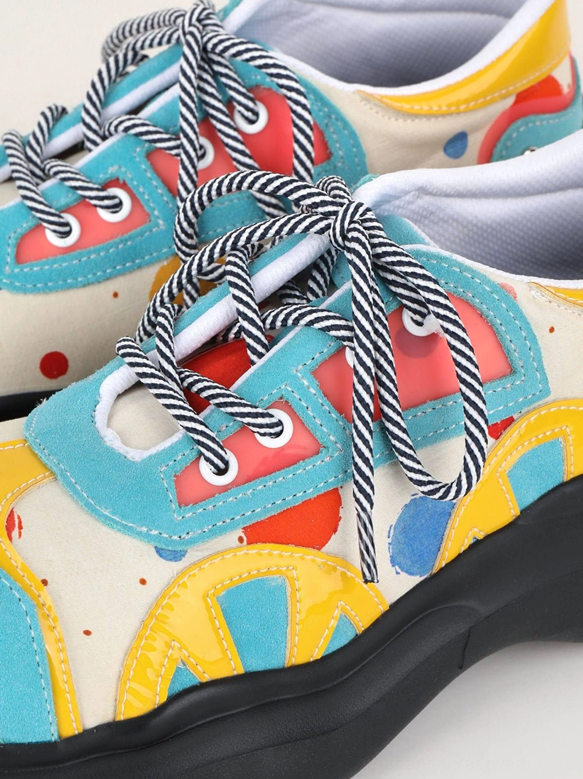 Blue graffiti graphic platform derby shoes with colorful abstract print and chunky black sole product detail view