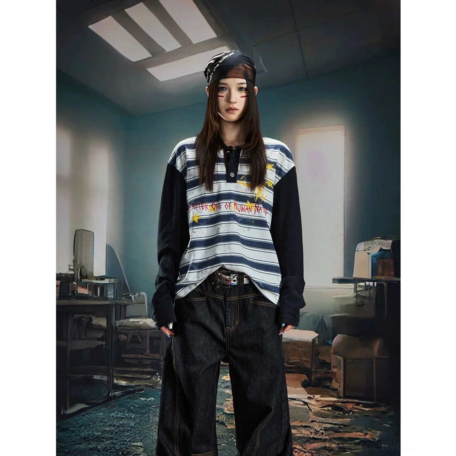 Blue grey striped long sleeve rugby polo shirt with black contrast collar and sleeves, yellow star motifs, red graffiti lettering, and relaxed boxy streetwear fit
