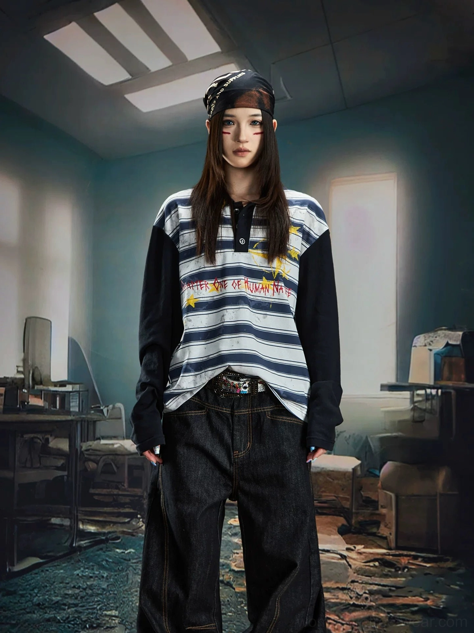 Female model wearing a blue grey striped long sleeve rugby polo shirt with dark wash baggy jeans and a printed bandana in her hair
