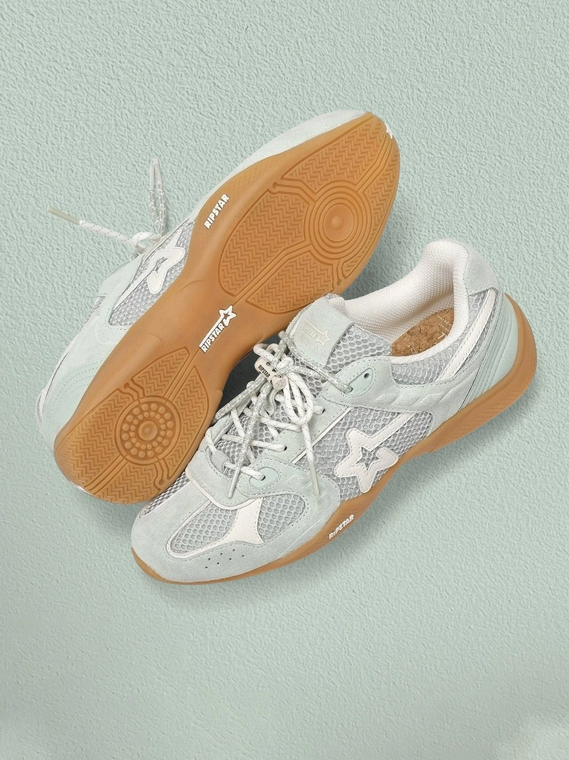 Blue mesh star German trainer sneakers outsole view showing textured gum rubber soles and lace-up mesh upper
