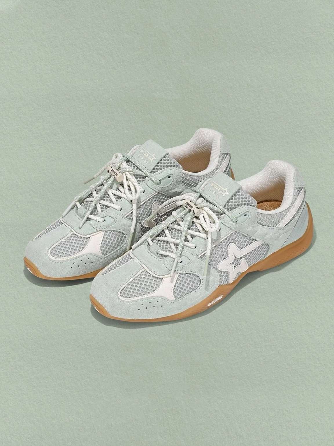 Blue mesh star German trainer sneakers close-up product view with breathable mesh star applique and rubber sole