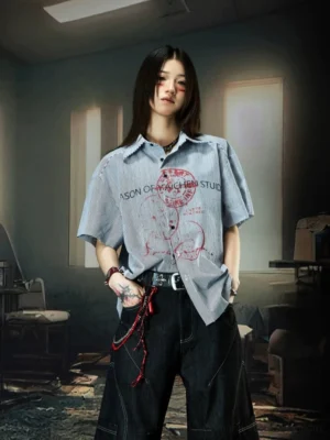 Blue pinstripe graffiti camp collar streetwear shirt with red front graphic print styled on female model
