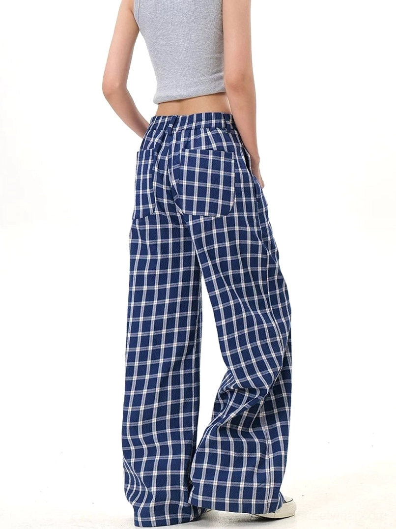 Back view of blue plaid wide-leg streetwear pants with belt loops and back pocket detail
