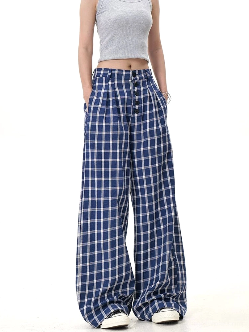 Blue plaid wide-leg streetwear trousers shown in a three-quarter view with side pockets and high waist